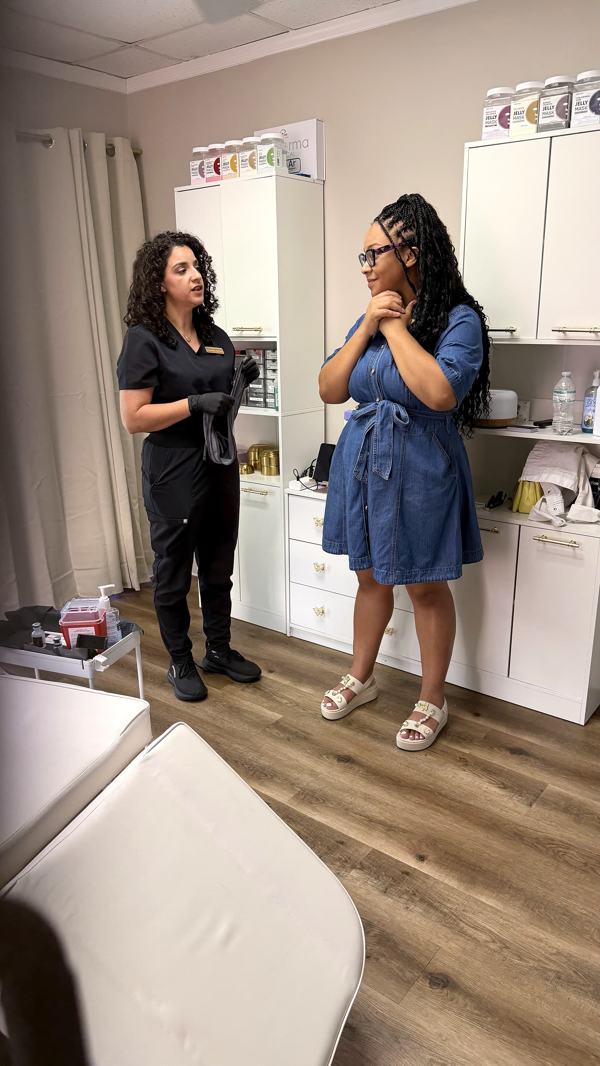 Dr. Espinet consulting with a patient during a private in-home visit